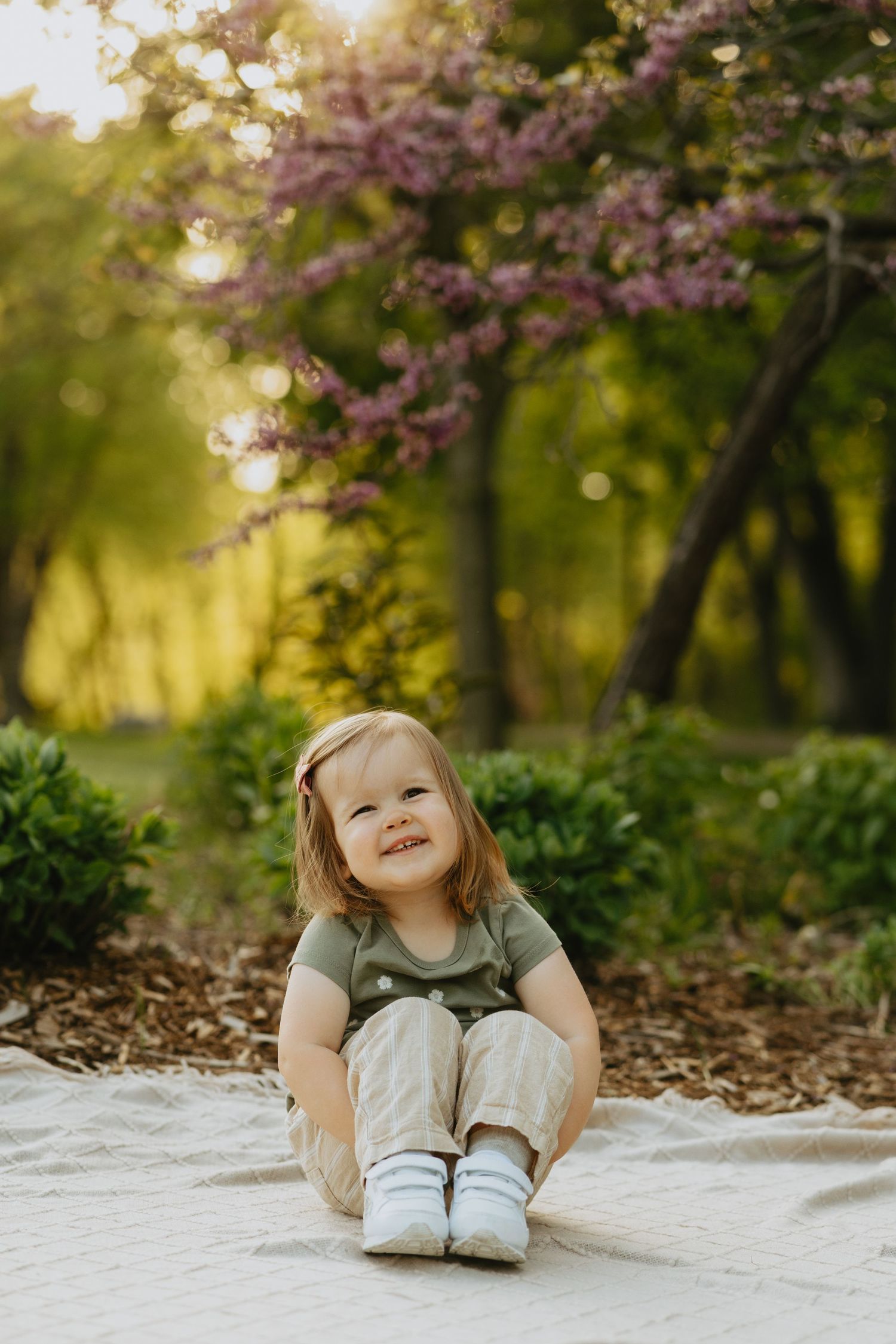Little girl sitting and smiling