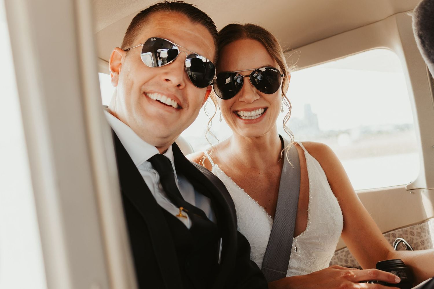 Bride and groom board their private plane for a short flight around St. Paul.