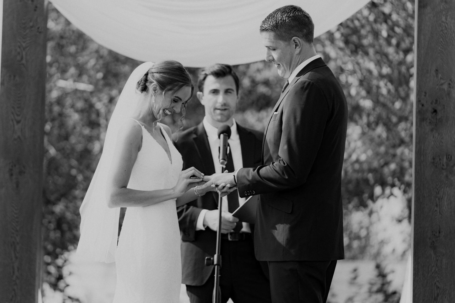Bride and groom exchange rings.