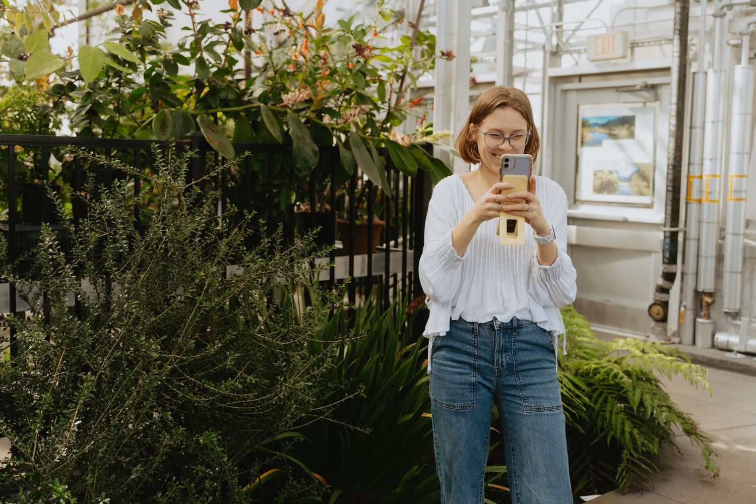 Artist taking a photo with her phone