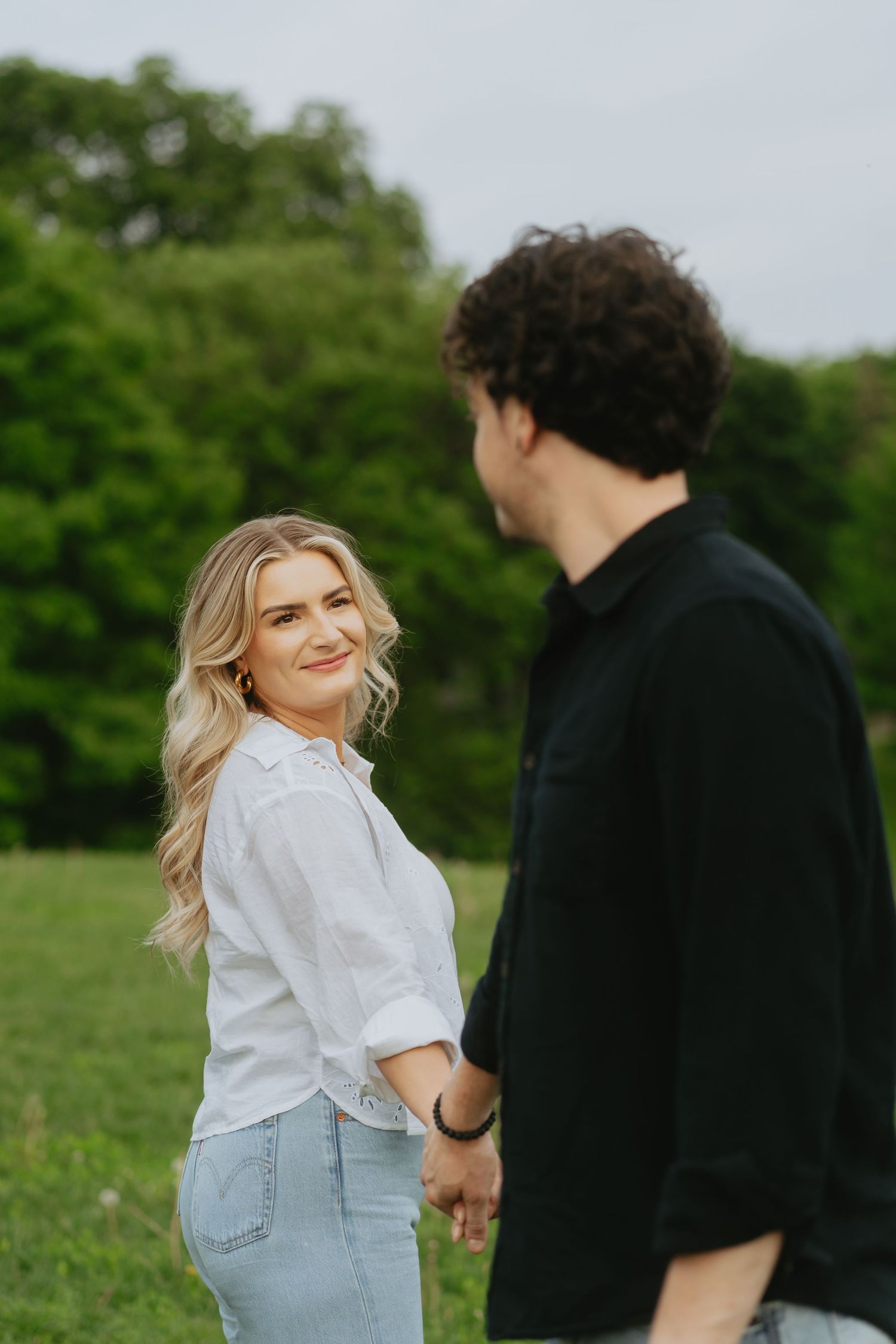 Couple holding hands and looking at each other