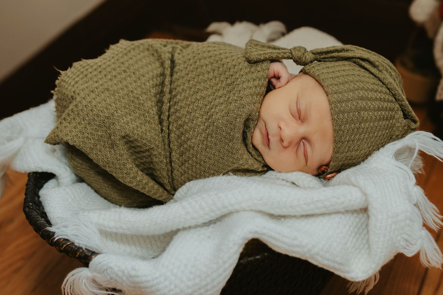 Newborn baby in a basket