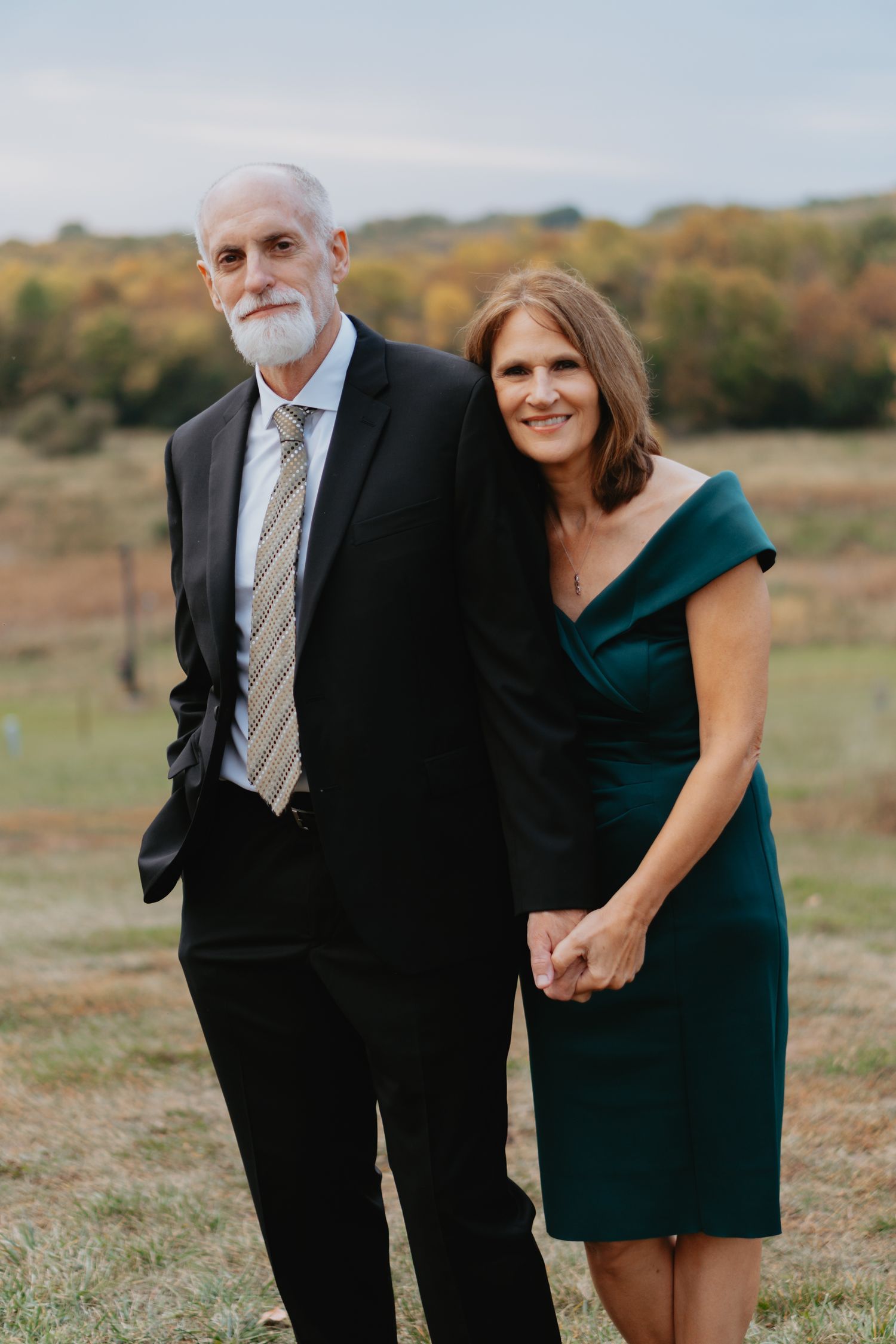 Couple posing on a hill