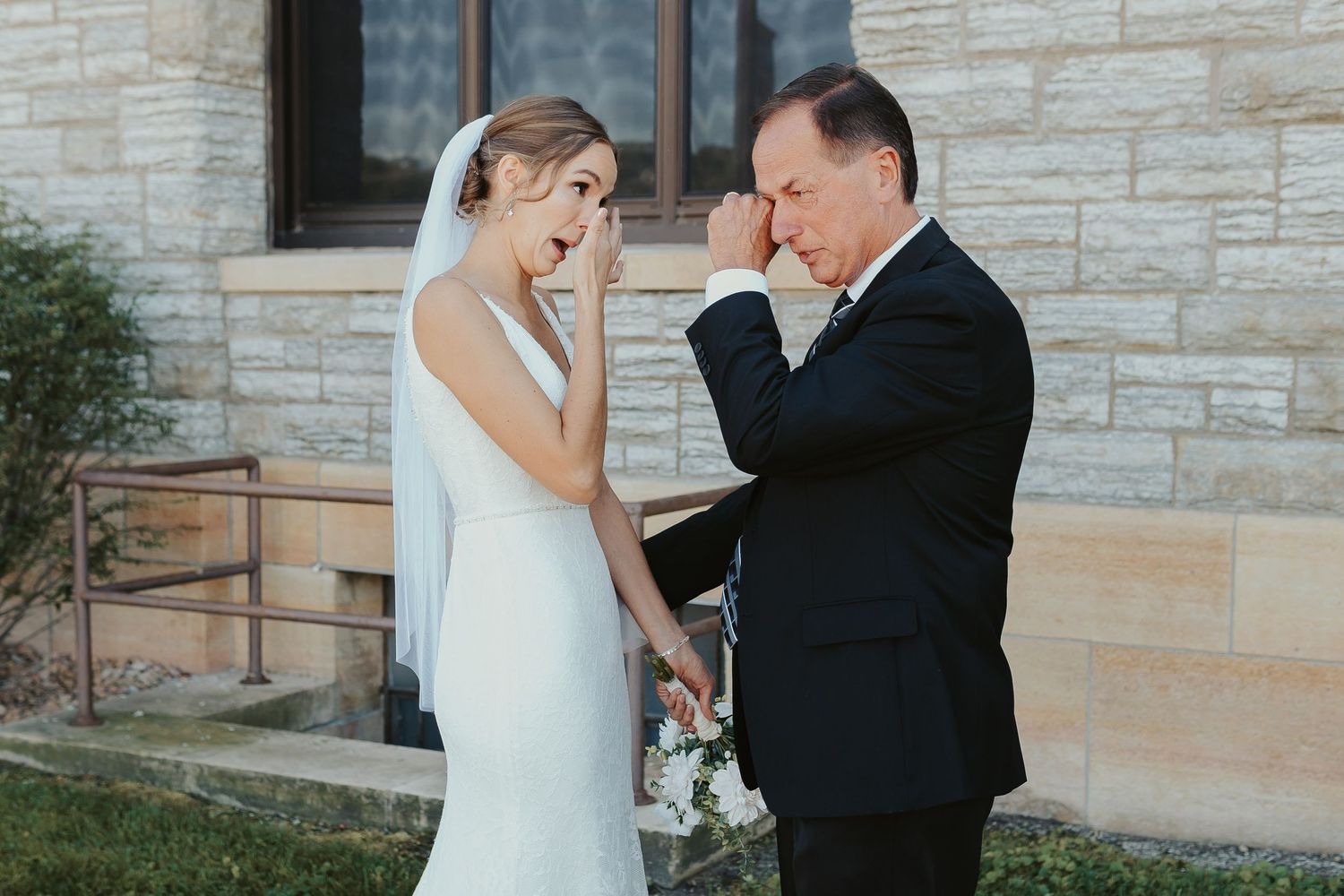 Bride and her father both wipe away tears after emotional first look.