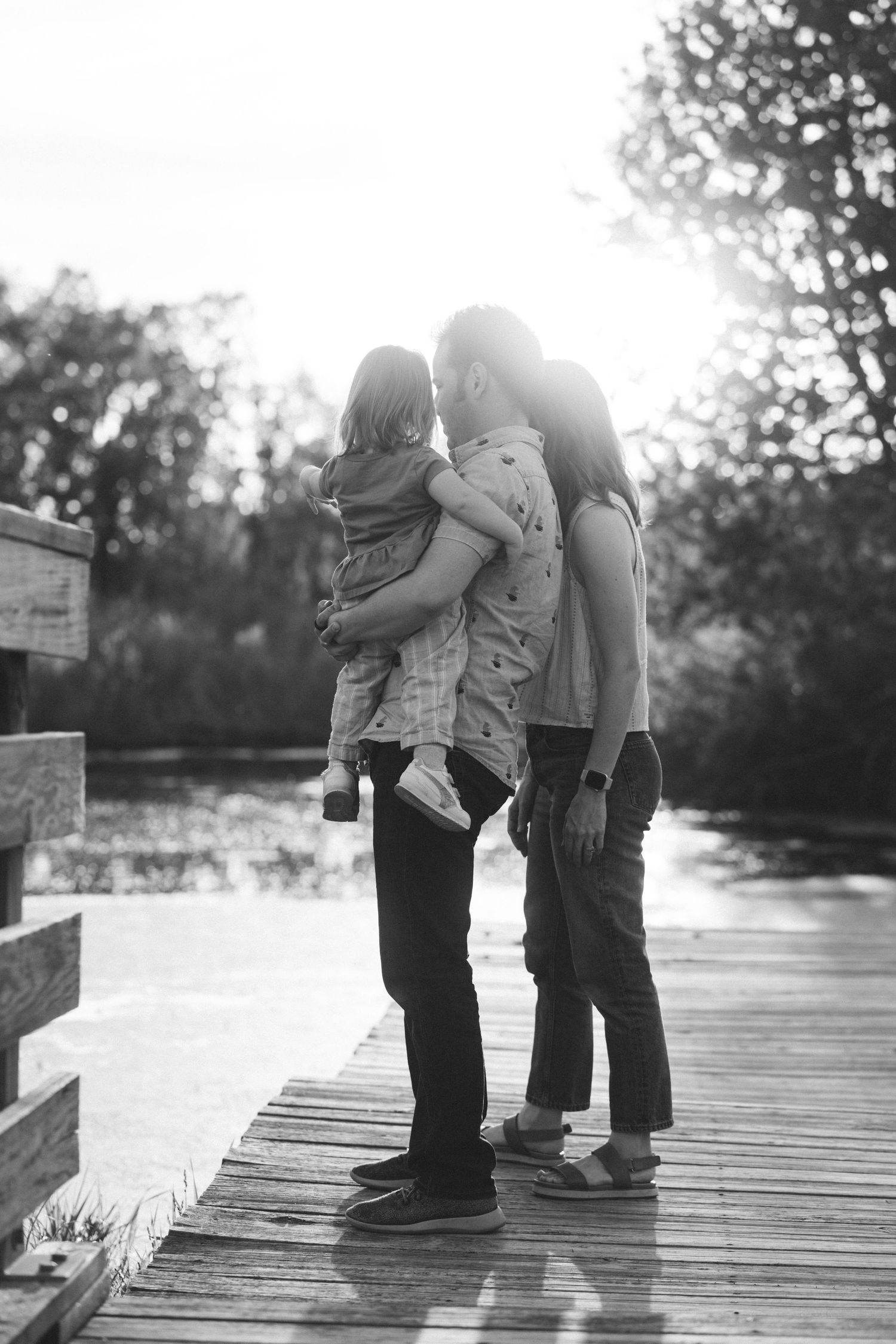 Family looking out at a pond together