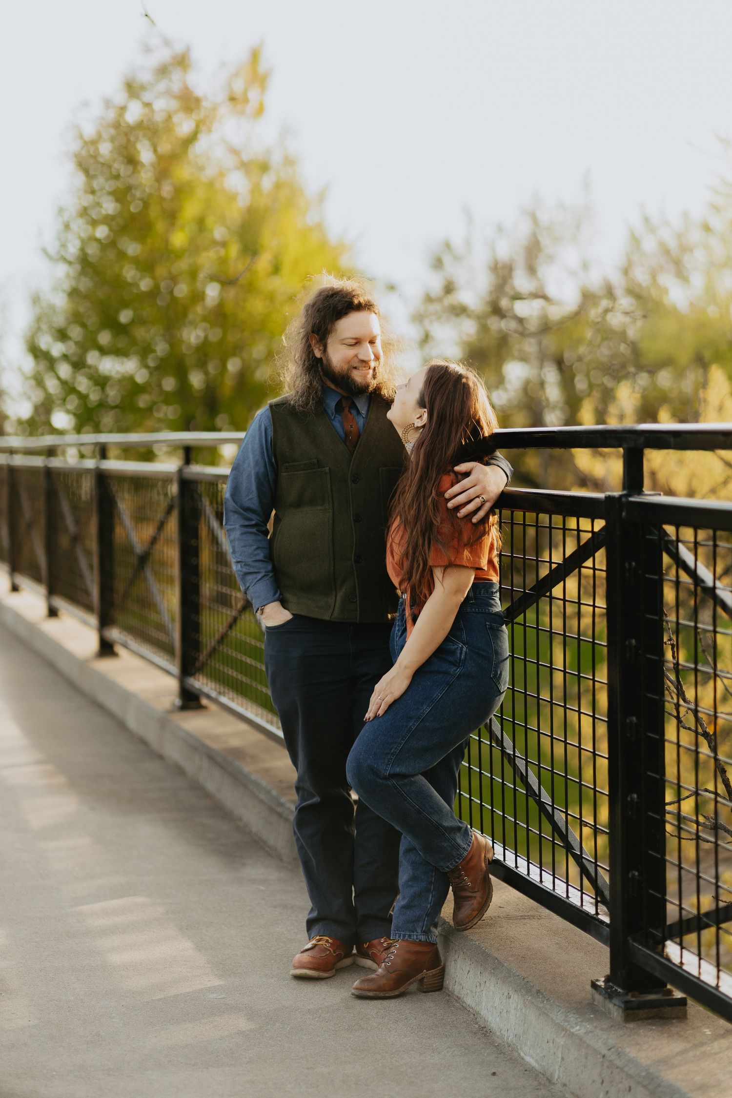 Couple standing on a bridge