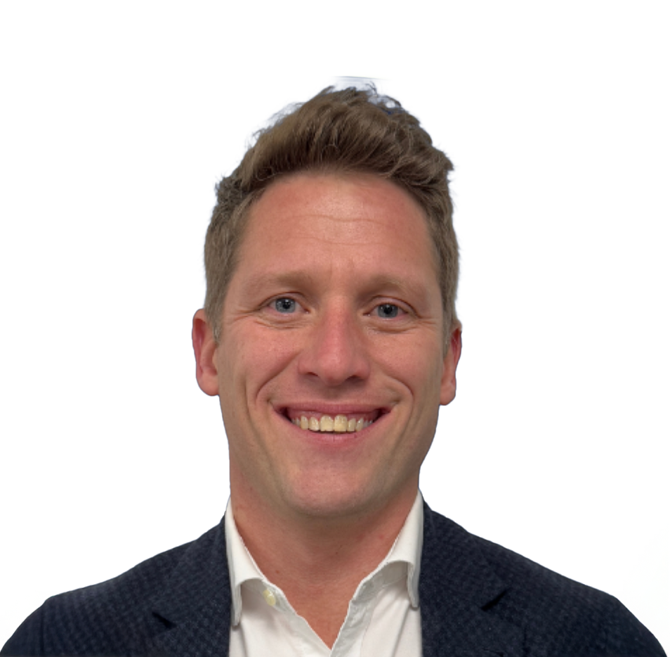 Professional headshot of a smiling blond man in a navy blazer and white shirt against a white background.
