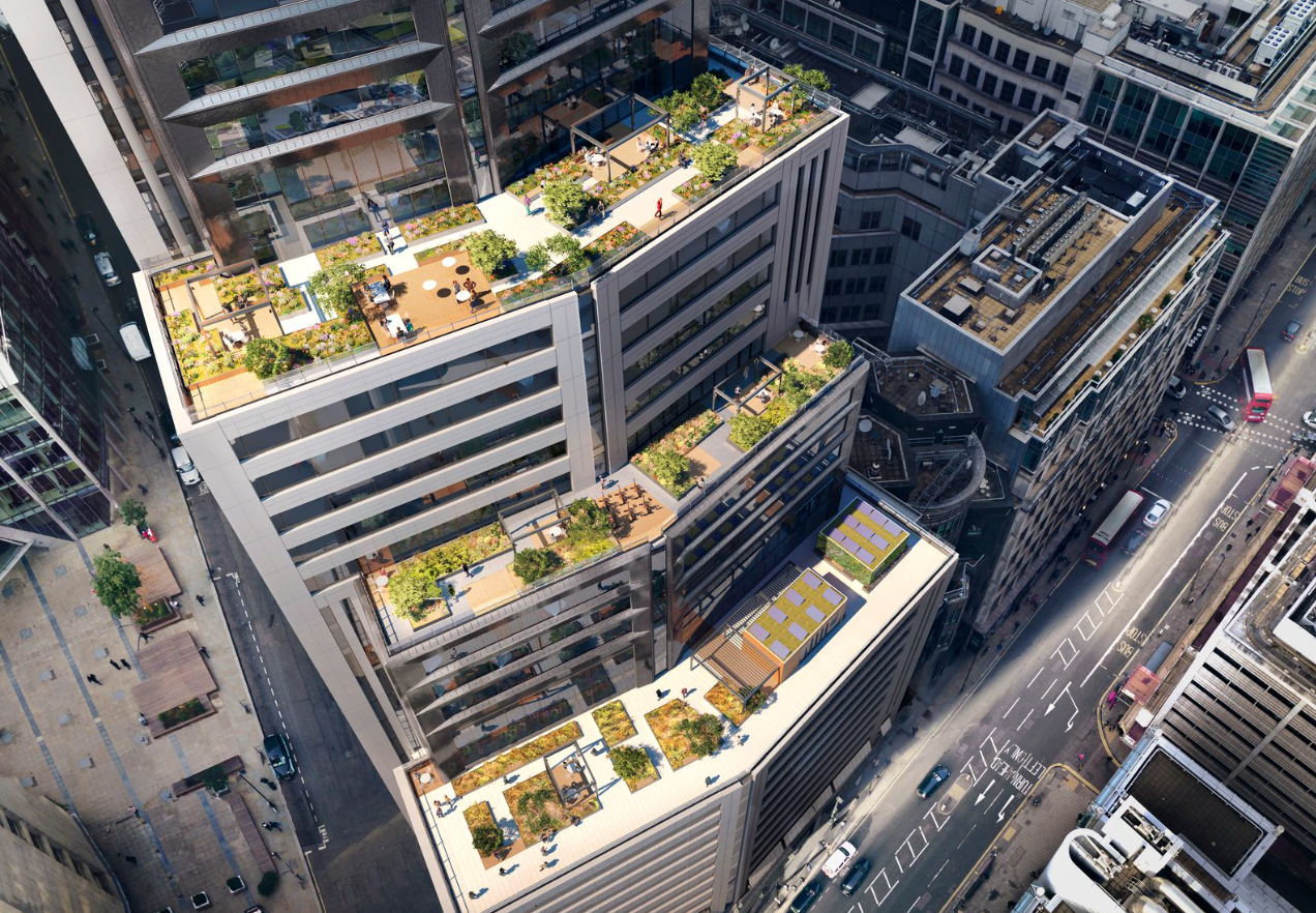 Aerial view of urban rooftop gardens on modern city buildings with lush greenery amid downtown skyscrapers.