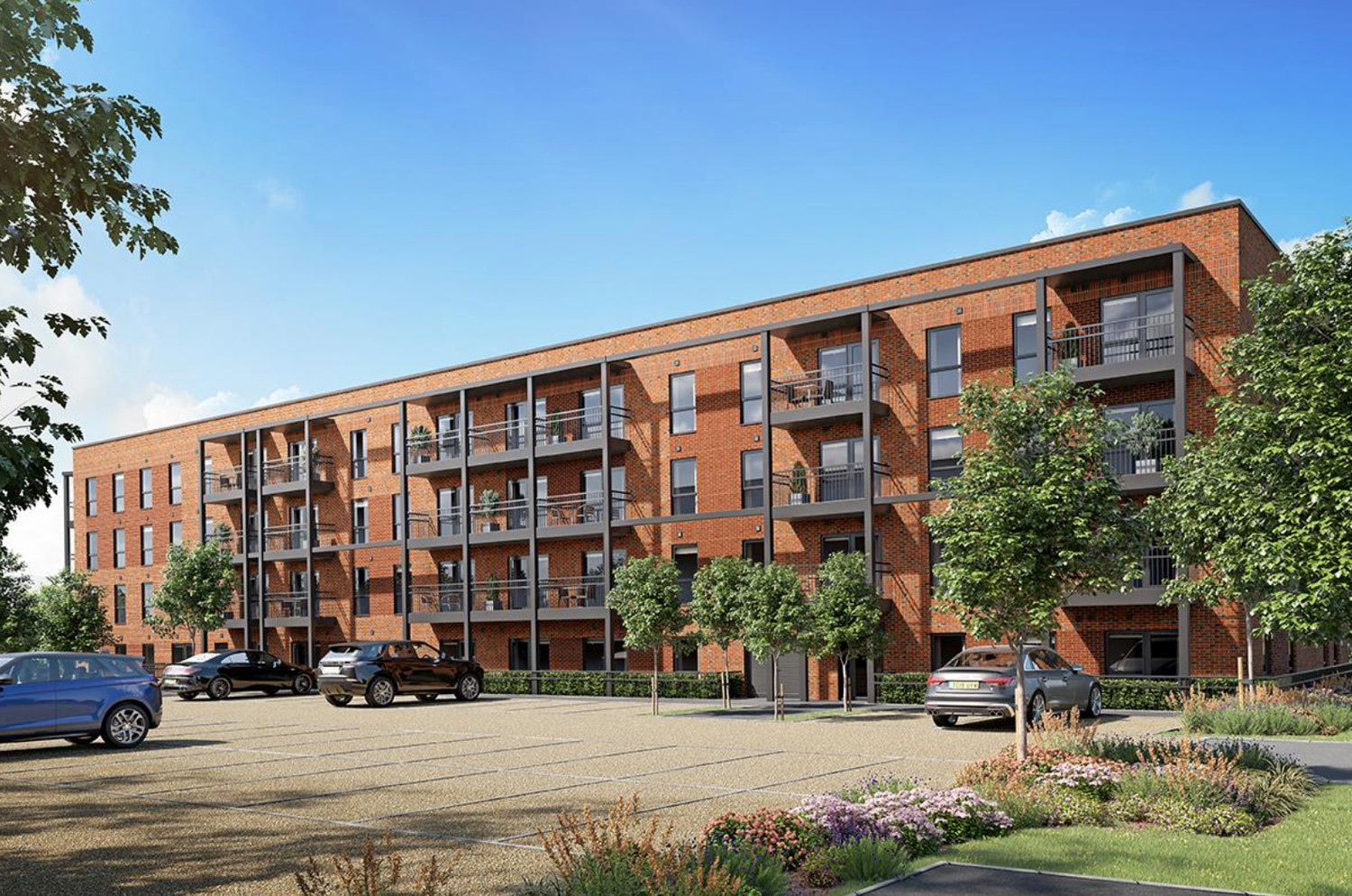 Modern brick apartment complex with balconies, landscaped grounds, and parking area under a clear blue sky.