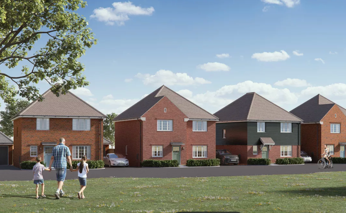 Panoramic view of identical brick homes in a suburban neighborhood with green lawns under blue skies.
