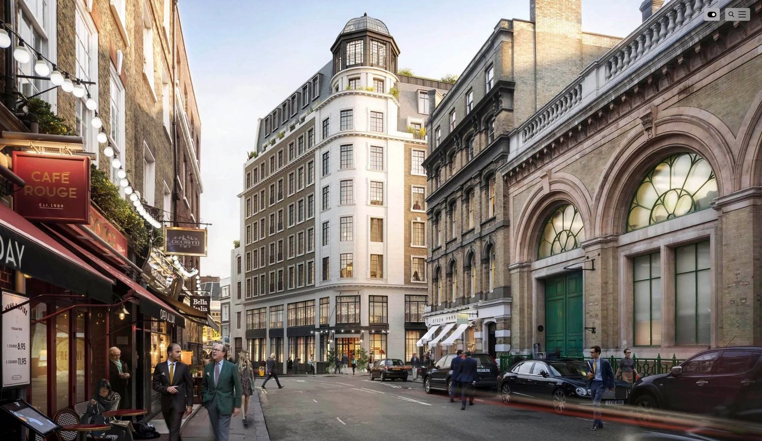 Historic London street with elegant beige buildings, arched windows, and pedestrians walking along a cobblestone road.