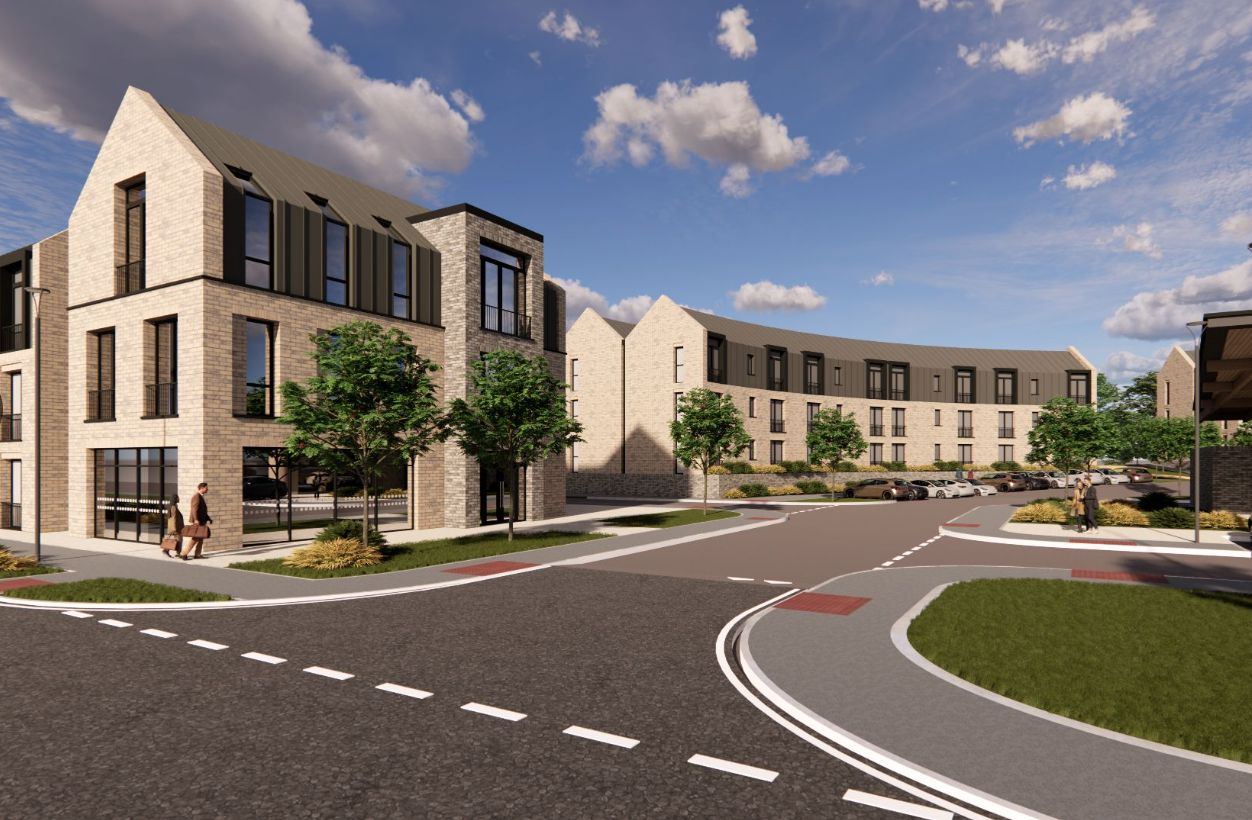 Modern residential development with brick buildings, landscaped grounds, and curved road under blue sky.