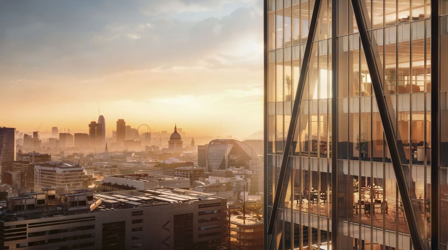 Golden sunset over London skyline with modern glass skyscraper in foreground and St Paul's Cathedral visible in background.
