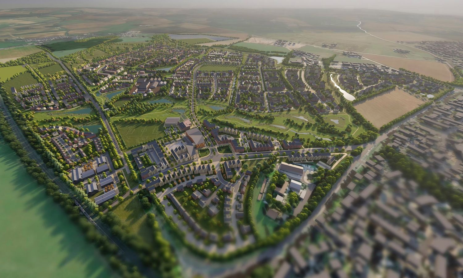 Aerial view of a modern planned urban development with green spaces, residential areas, and roads in a suburban landscape.