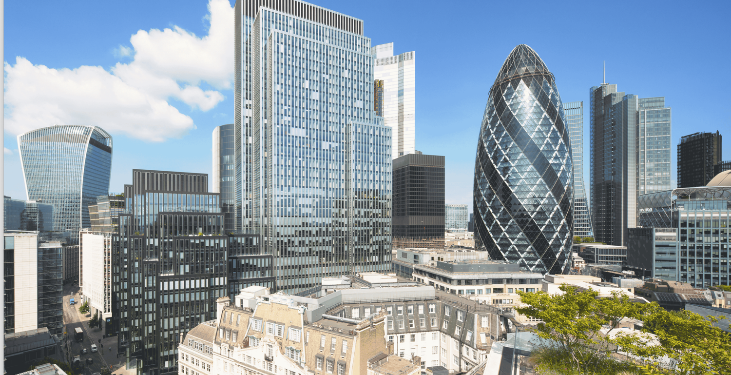 Aerial view of London City skyline featuring the iconic Gherkin skyscraper among modern office buildings under blue sky.