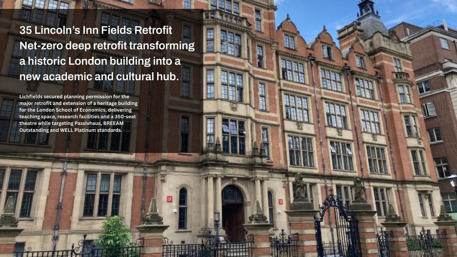 Historic red brick building with ornate Victorian architecture and arched windows at the Royal Holloway University of London.