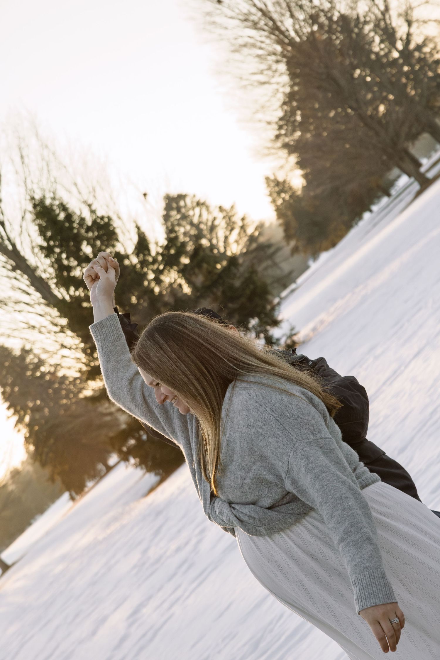couple dancing outside during golden hour in Michigan
