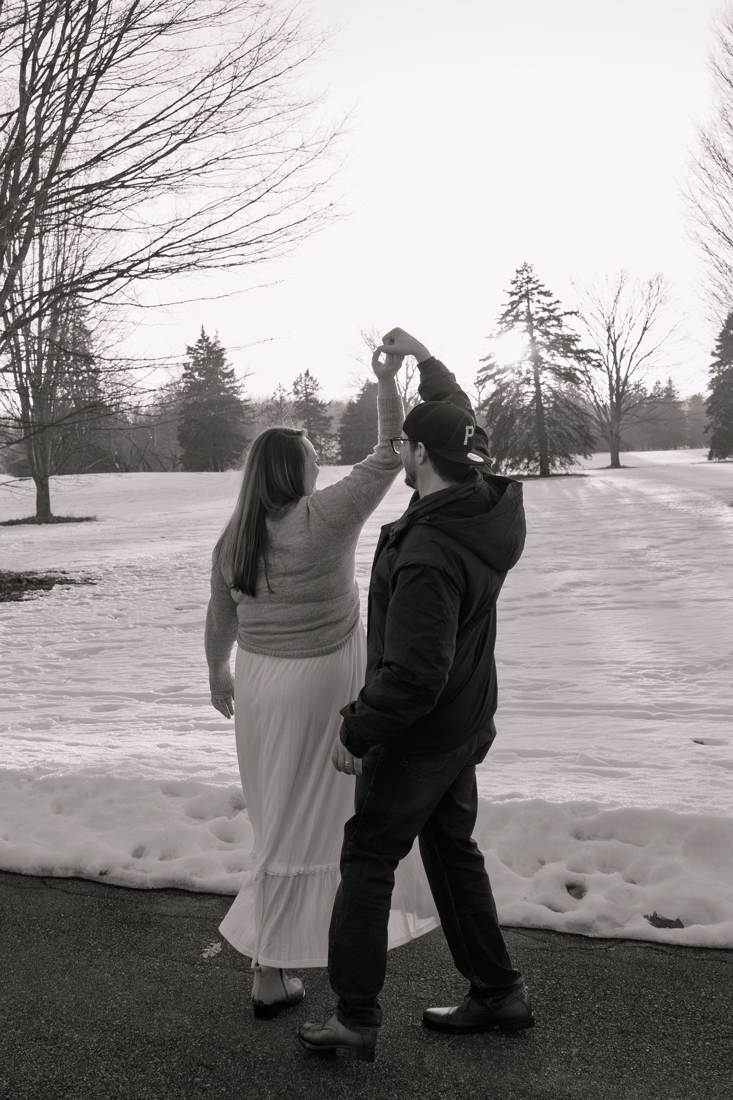couple dancing outside during golden hour in Michigan