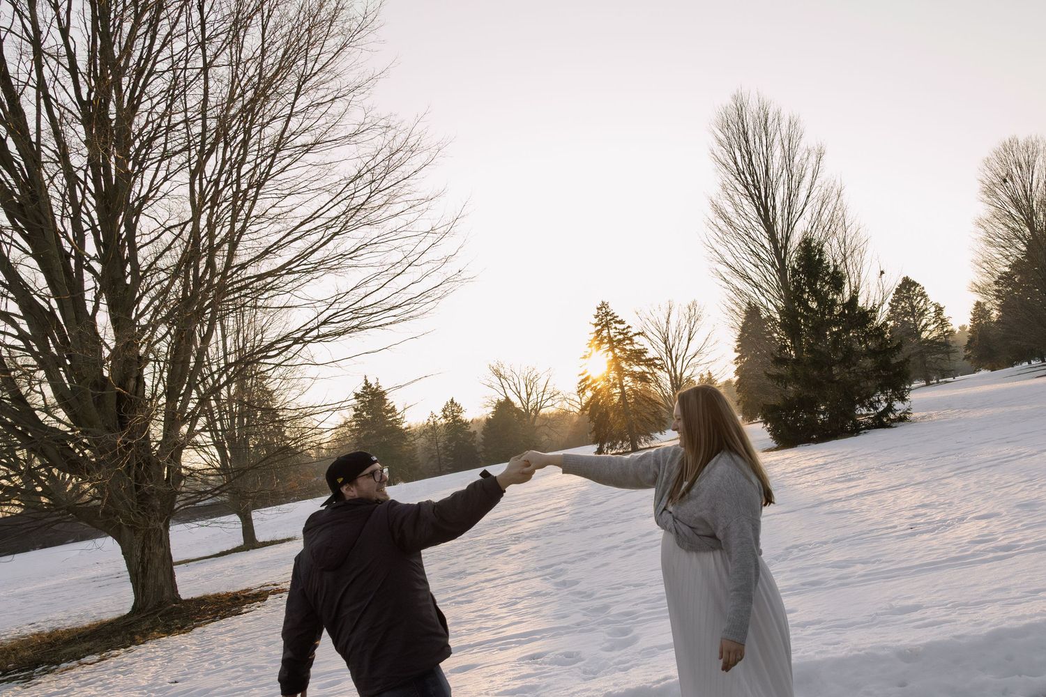 couple dancing outside during golden hour in Michigan