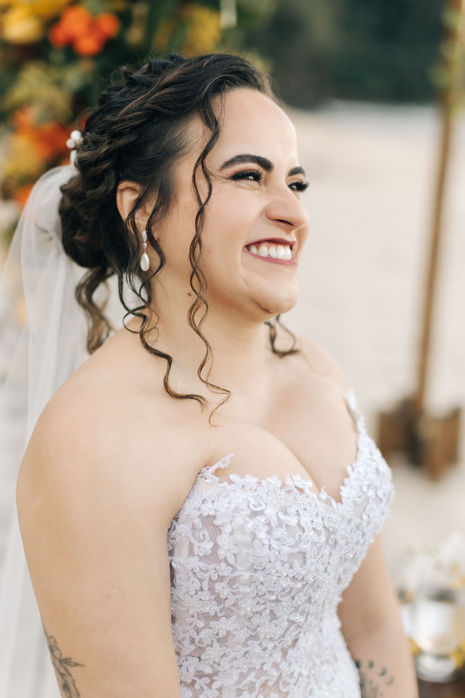 Beautiful lace wedding dress detail shown in a series of close-up shots against a natural outdoor background.