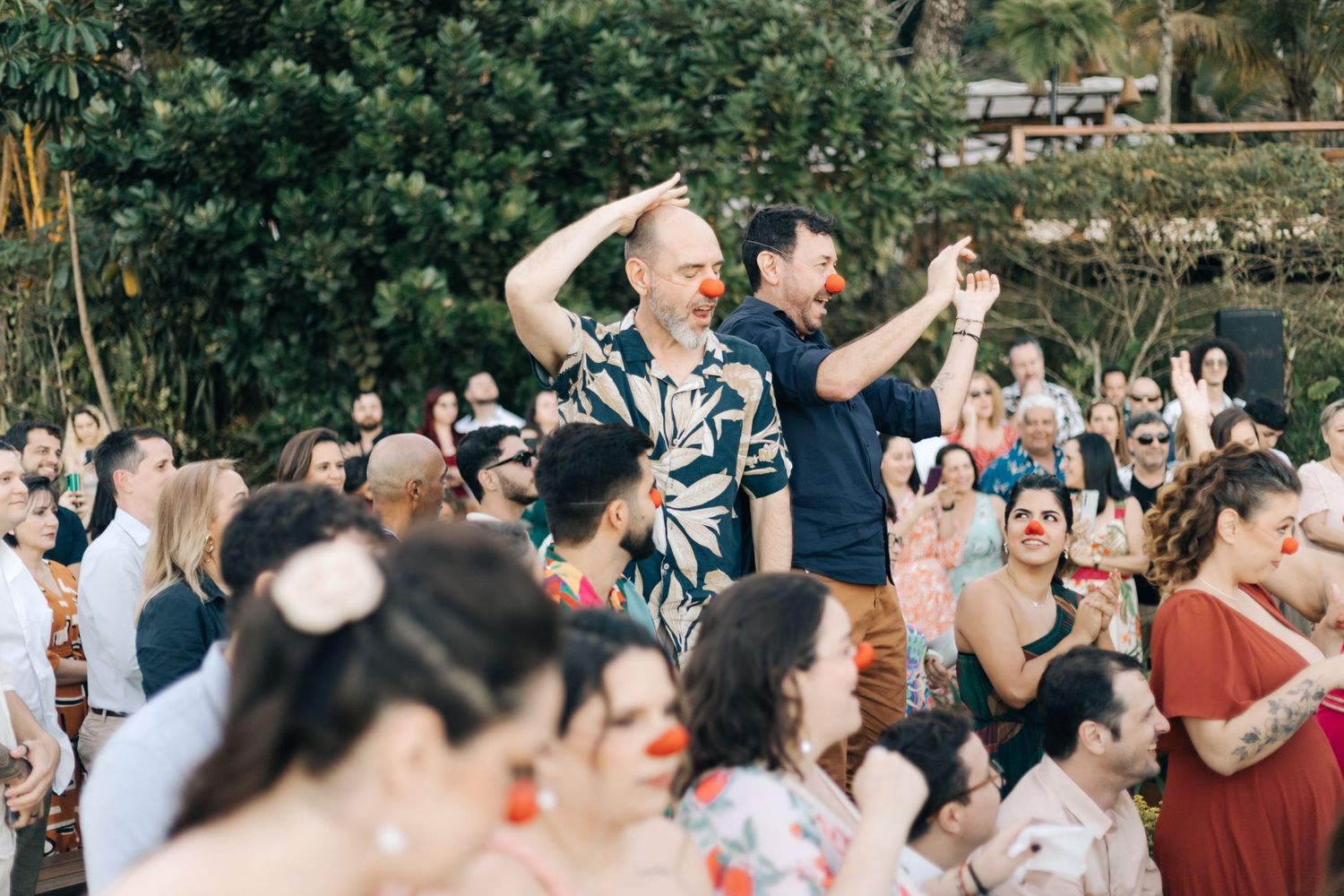 Guests dancing and celebrating at an outdoor wedding reception.