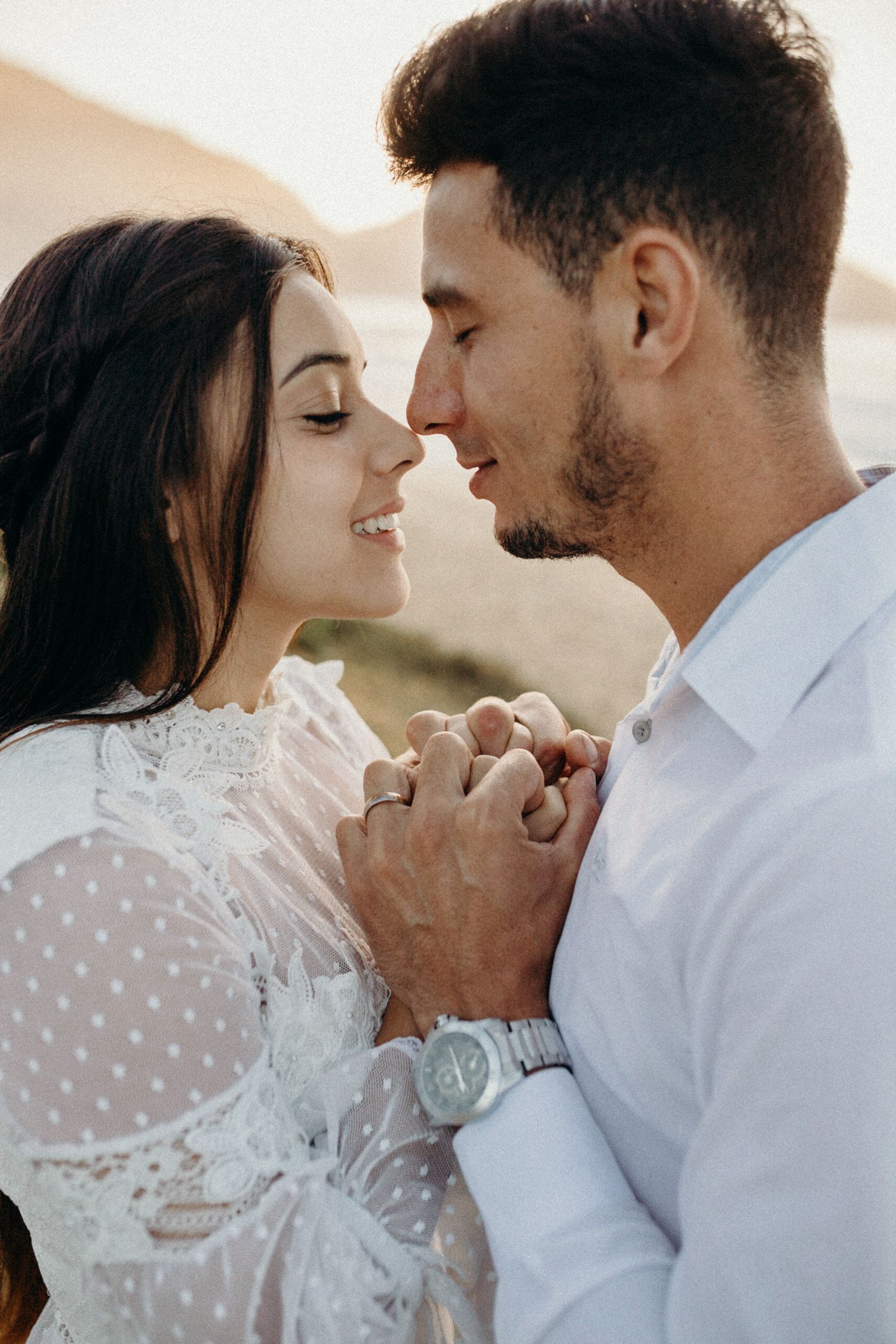 Intimate portrait series of couple in white lace and formal wear.