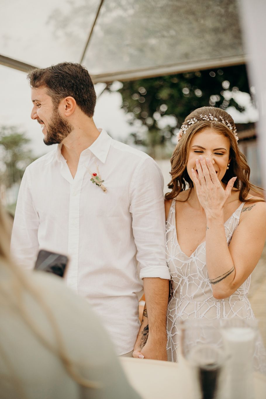 Emotional wedding reception scene with couple sharing tender moments.
