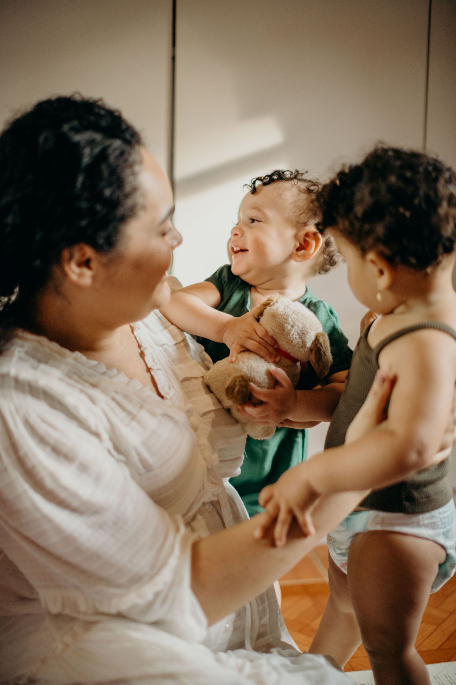 A joyful family moment with laughter and playful interactions on a sunny morning.