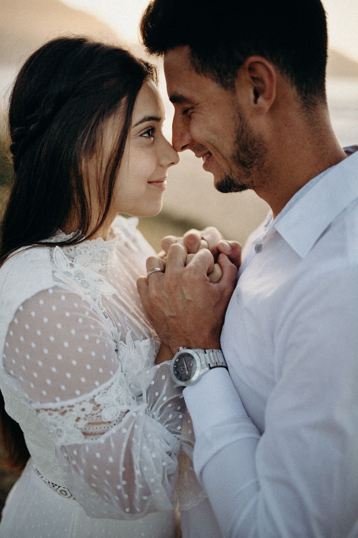 Romantic portraits with couple in delicate lace and white clothing.