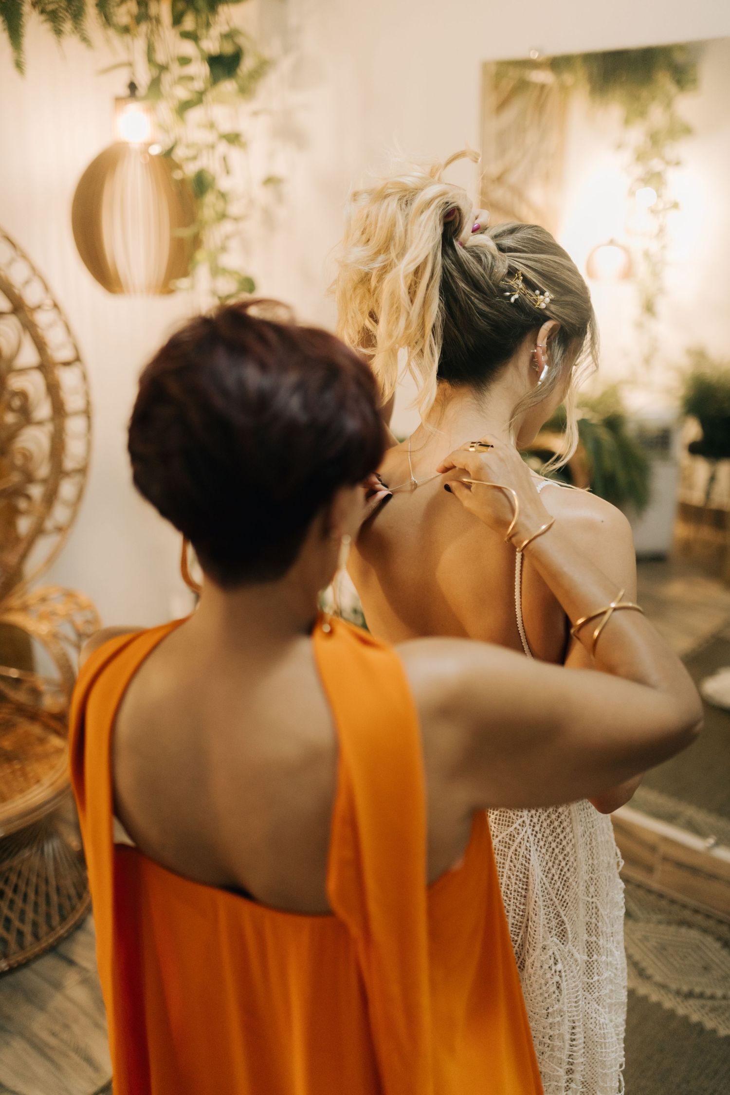 Close-up moment of two people in orange and white attire.