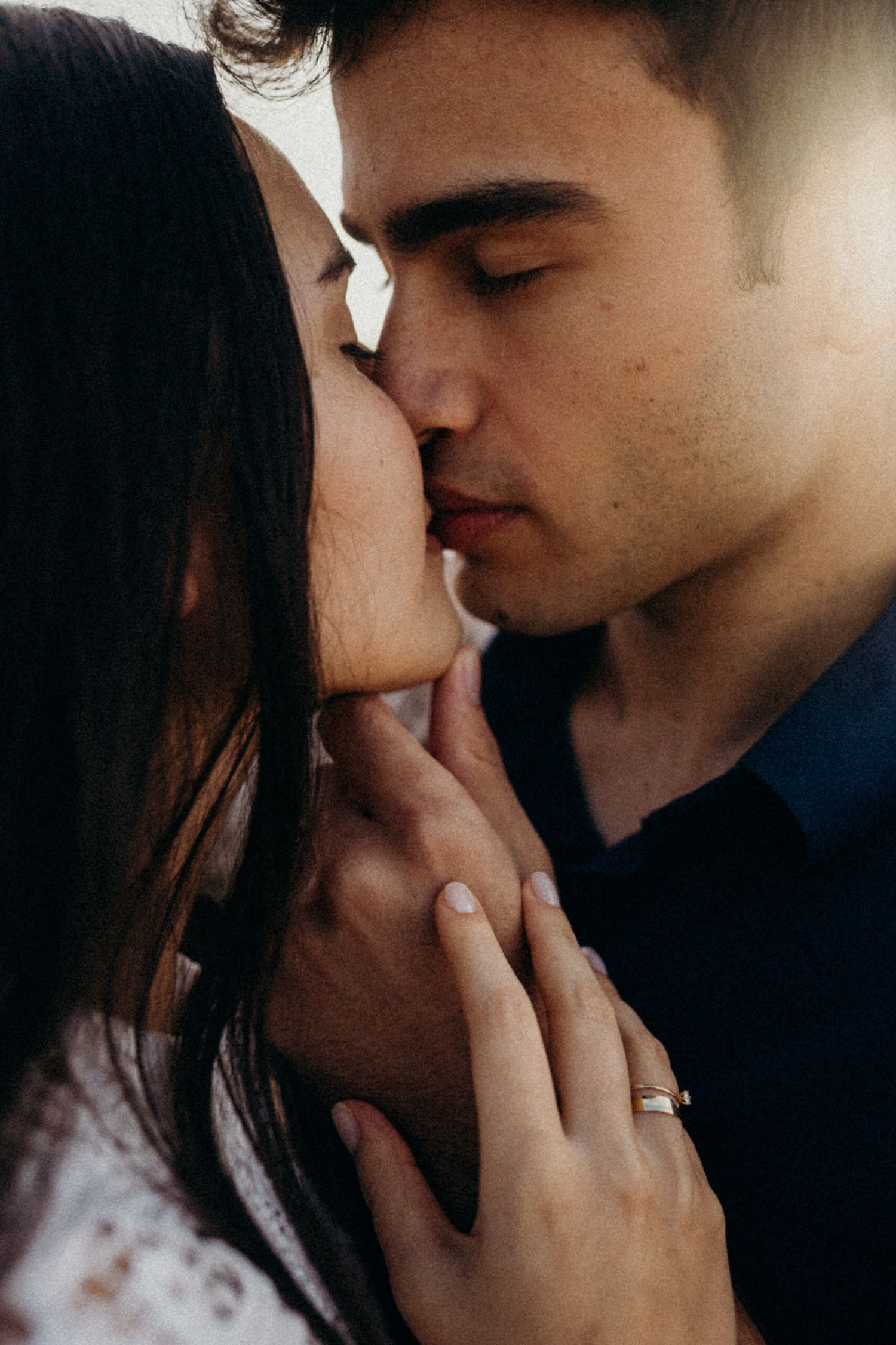 Dramatic close-up sequence of a romantic couple sharing an intimate moment in moody lighting.