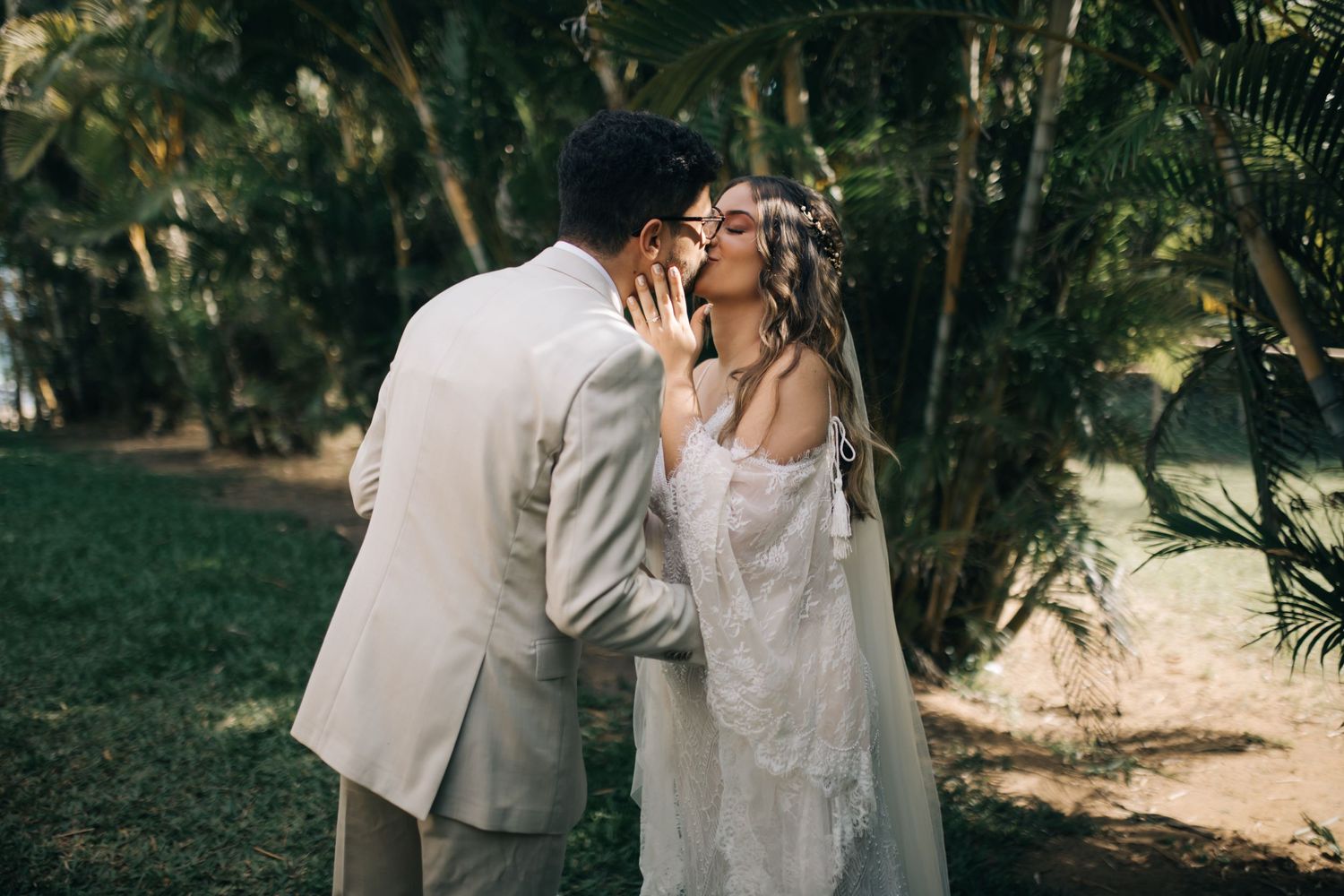 A tender moment between newlyweds during their garden wedding ceremony.