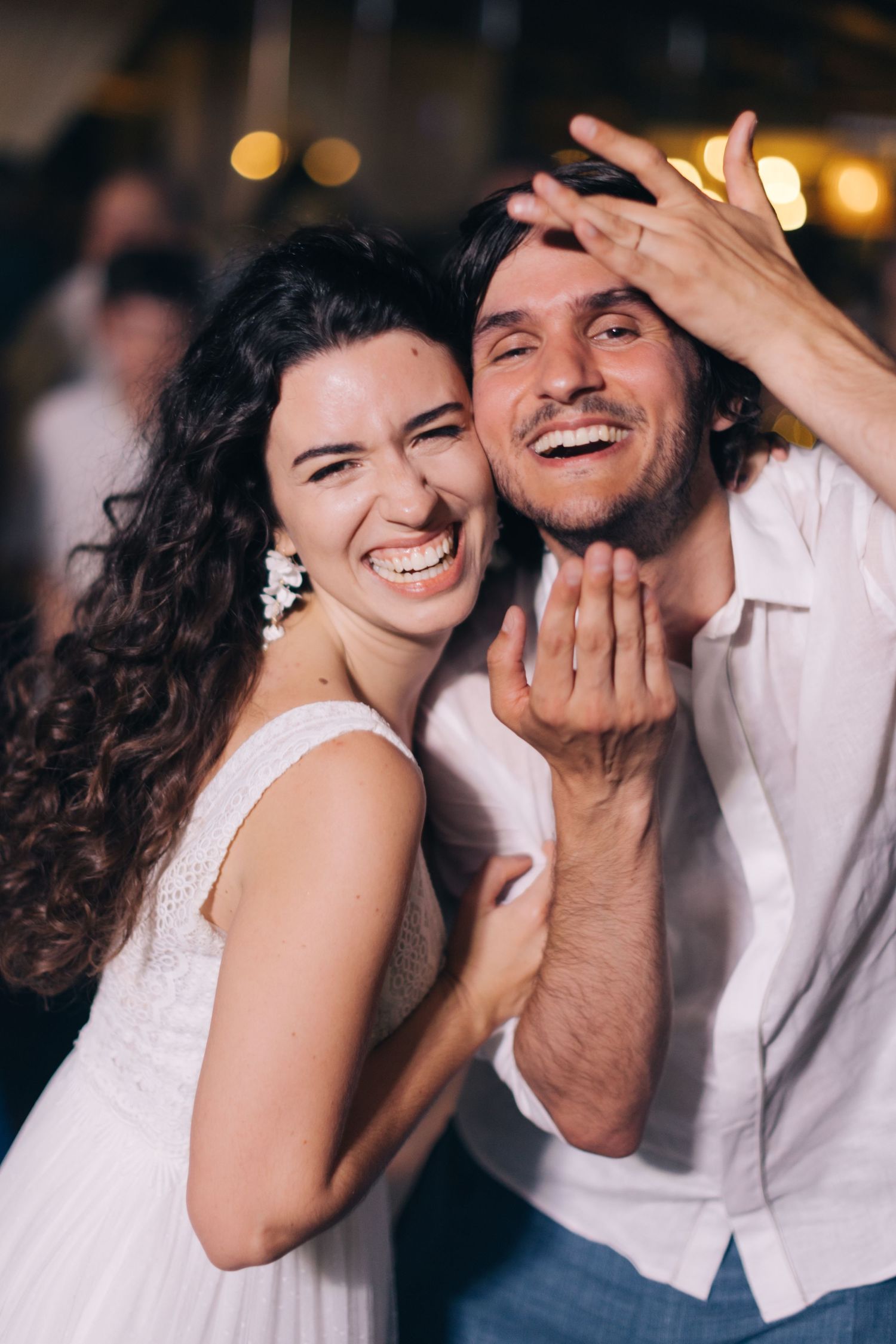 Series of candid moments showing playful interaction between two people in white clothing.