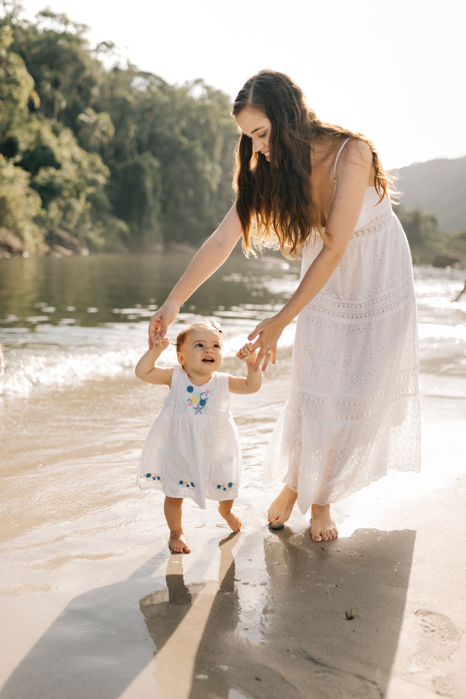 A touching family moment captured during sunset at the beach.
