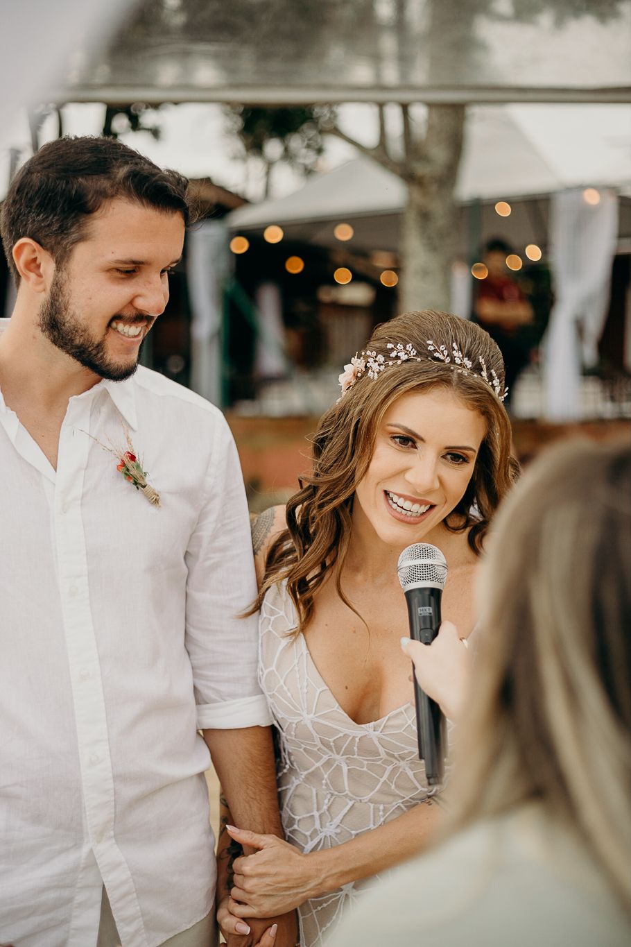 Candid wedding reception moment capturing genuine laughter and joy.
