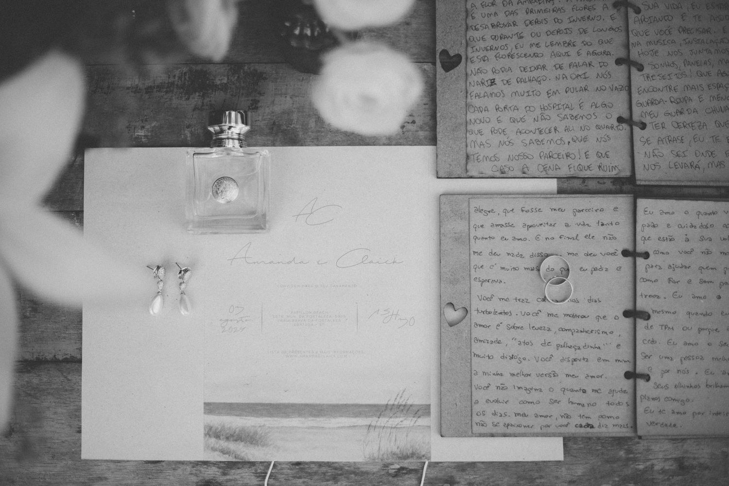 Black and white wedding details with handwritten notes and perfume bottle.
