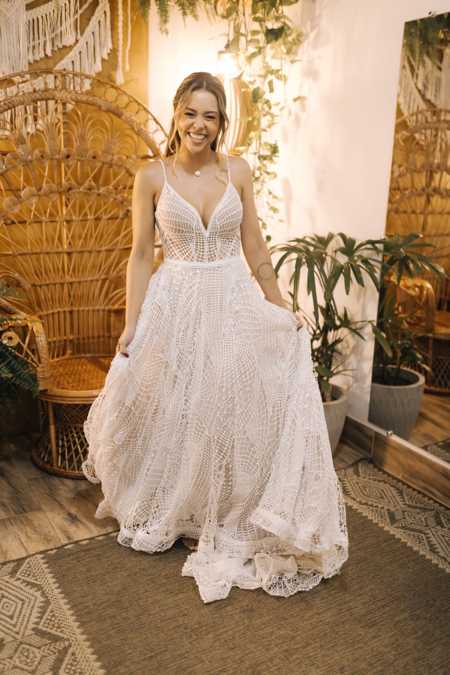 Beautiful lace wedding gown with v-neck bodice and intricate pattern details.