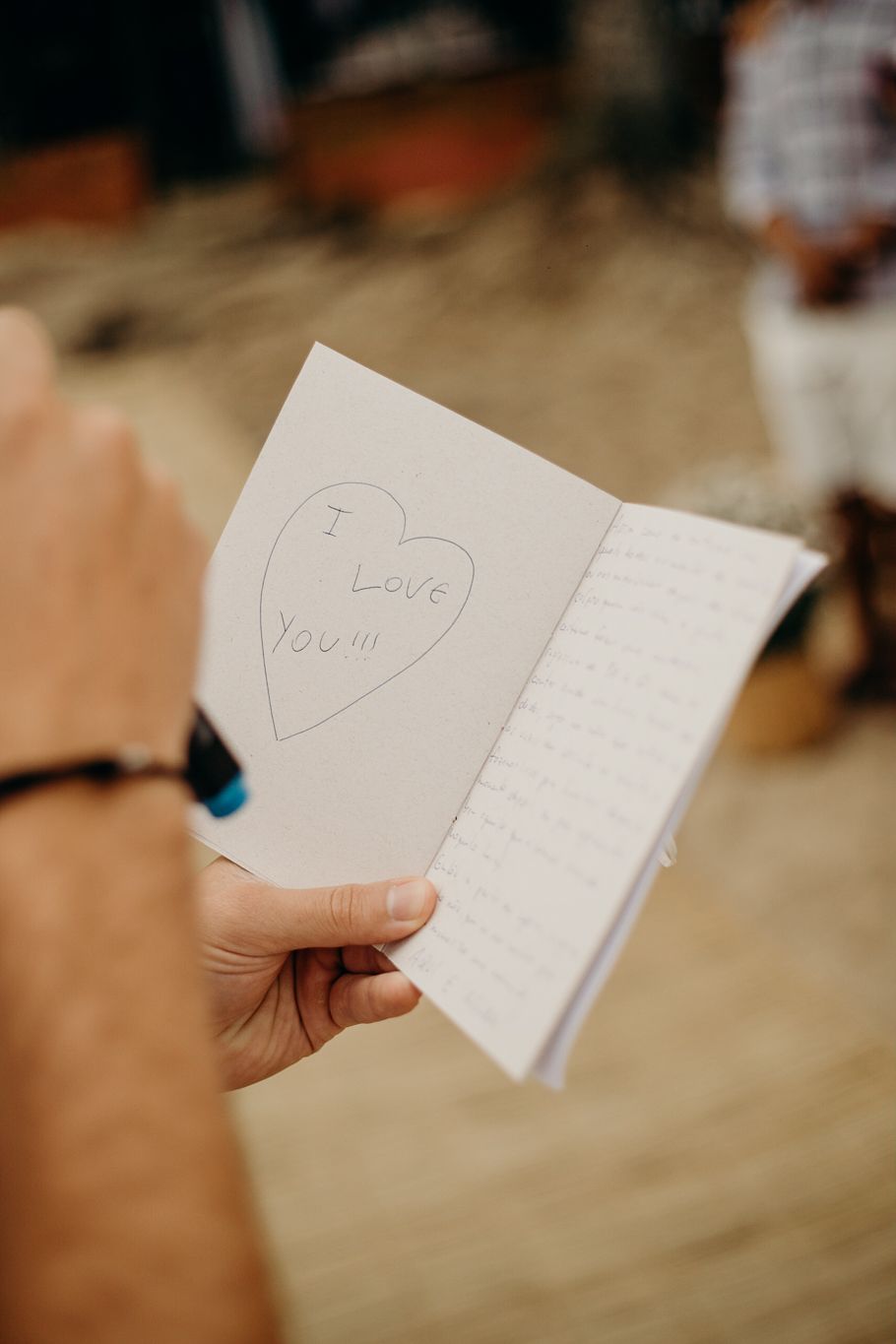 Love notes and handwritten cards being shared during a wedding celebration.