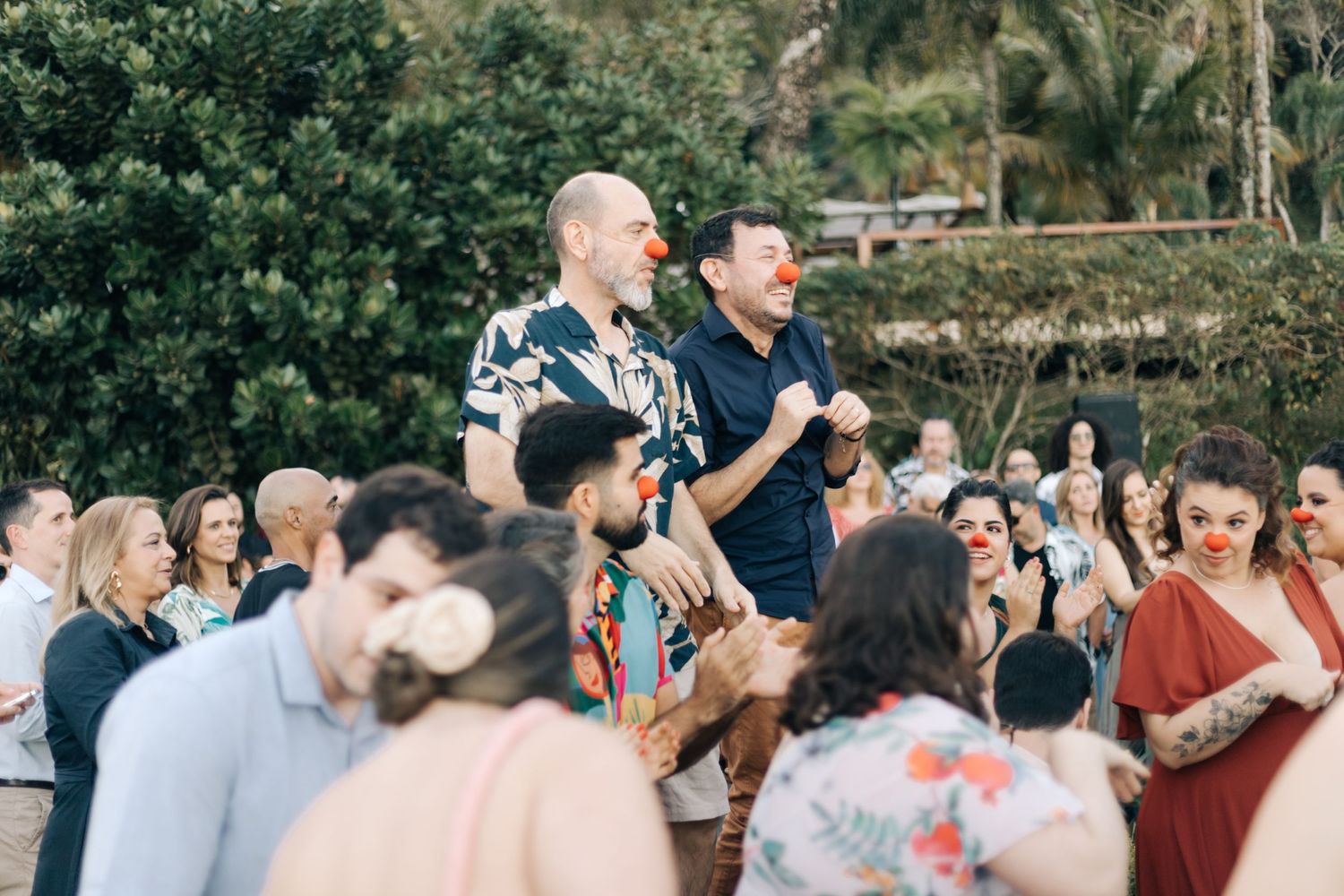 Wedding guests enjoying themselves during an outdoor celebration.