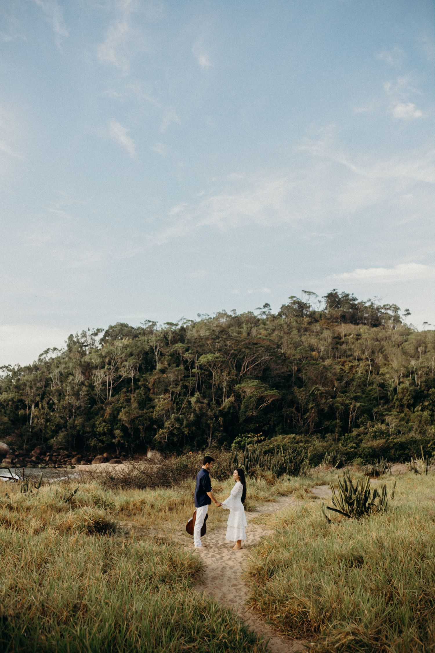 Rolling hills and native bushland create a scenic backdrop for an outdoor photoshoot.