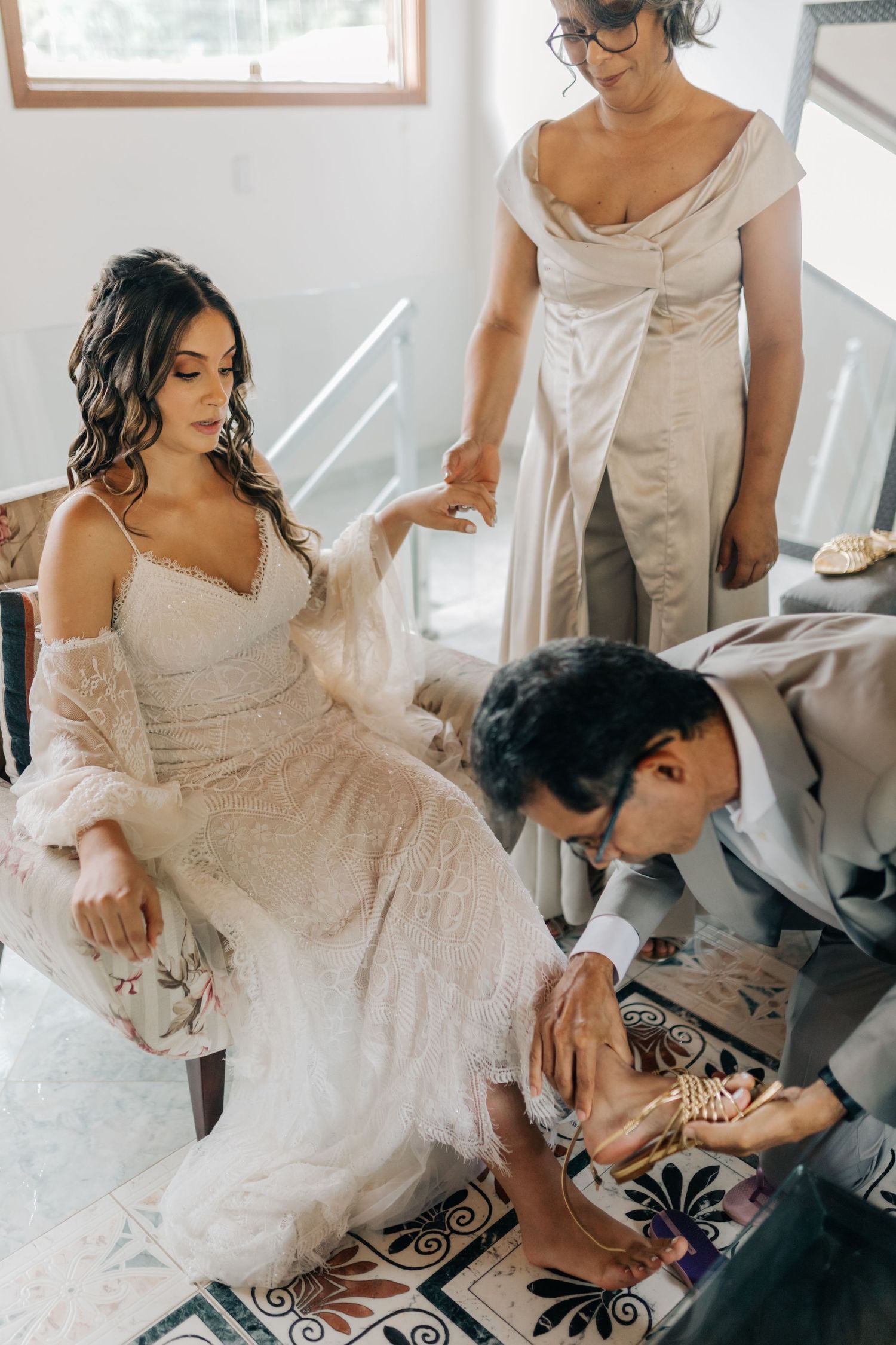 Wedding preparation scene on decorative tile floor.