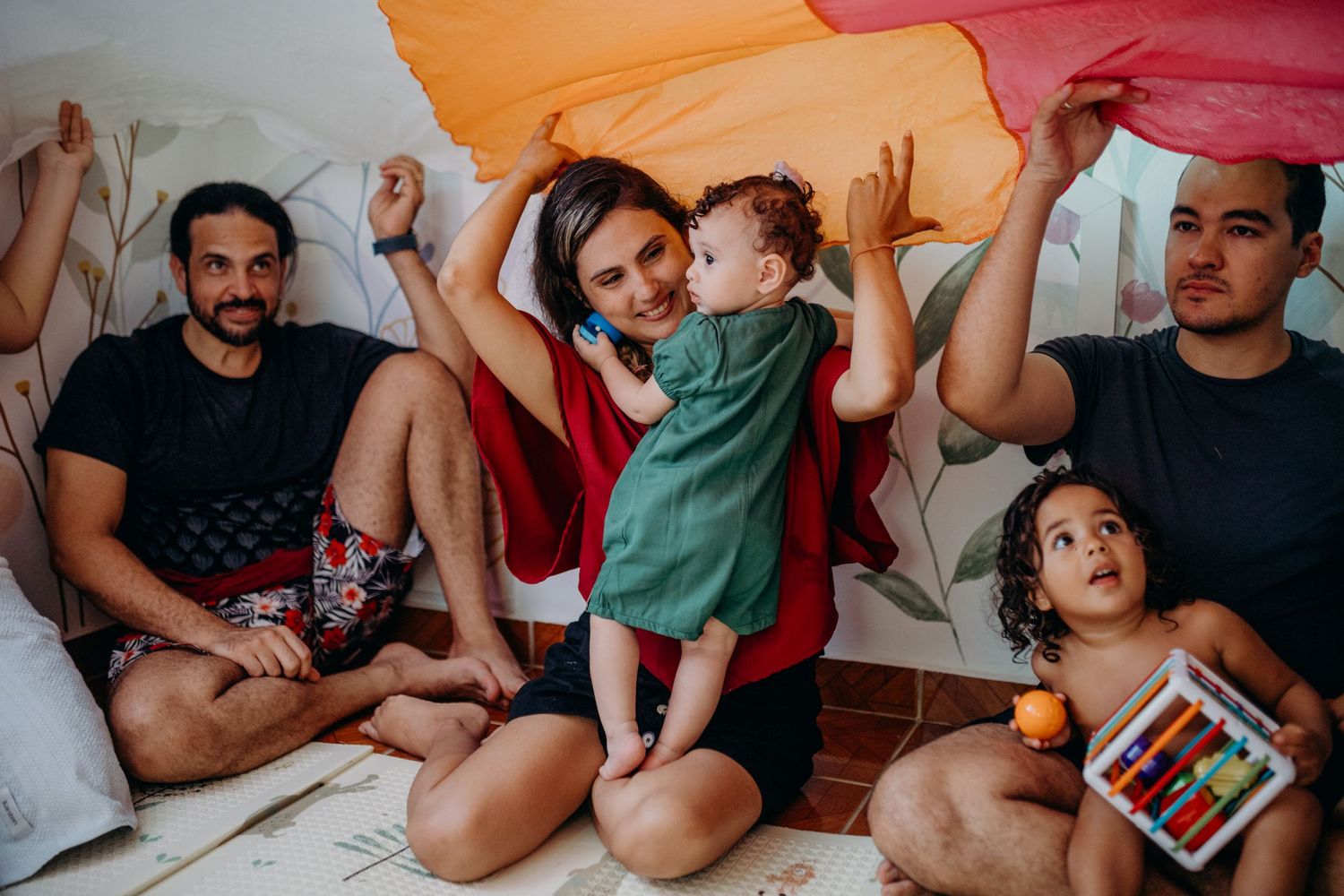Family gathering moment captured on a comfortable couch with relaxed expressions.
