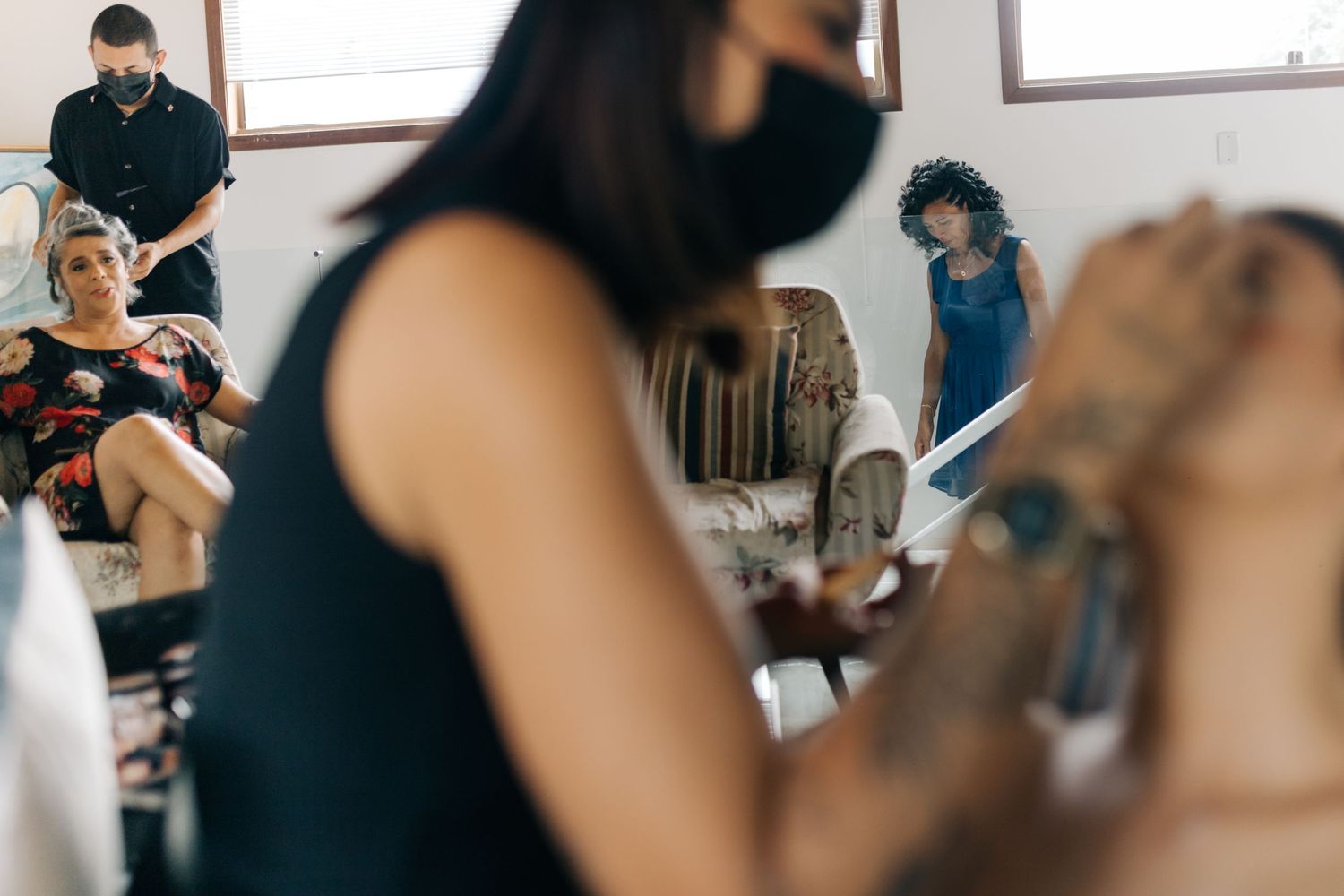 Behind the scenes shot of wedding preparation in bright indoor setting.