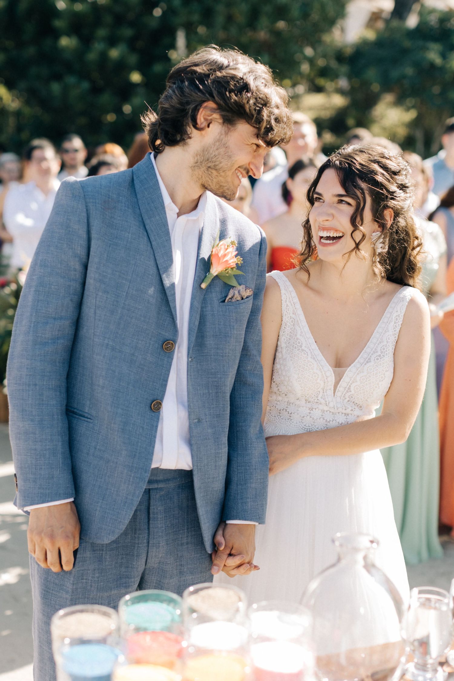 Couple sharing an intimate moment at their outdoor wedding reception.