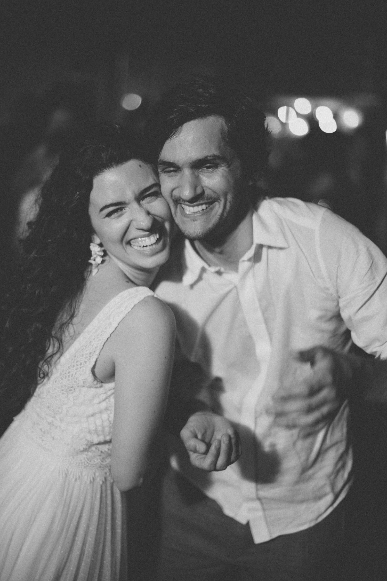 Black and white sequence capturing genuine laughter and tender moments between a couple.