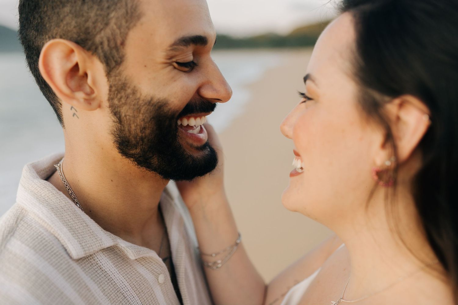Close up of a loving couple sharing an intimate moment at the beach.