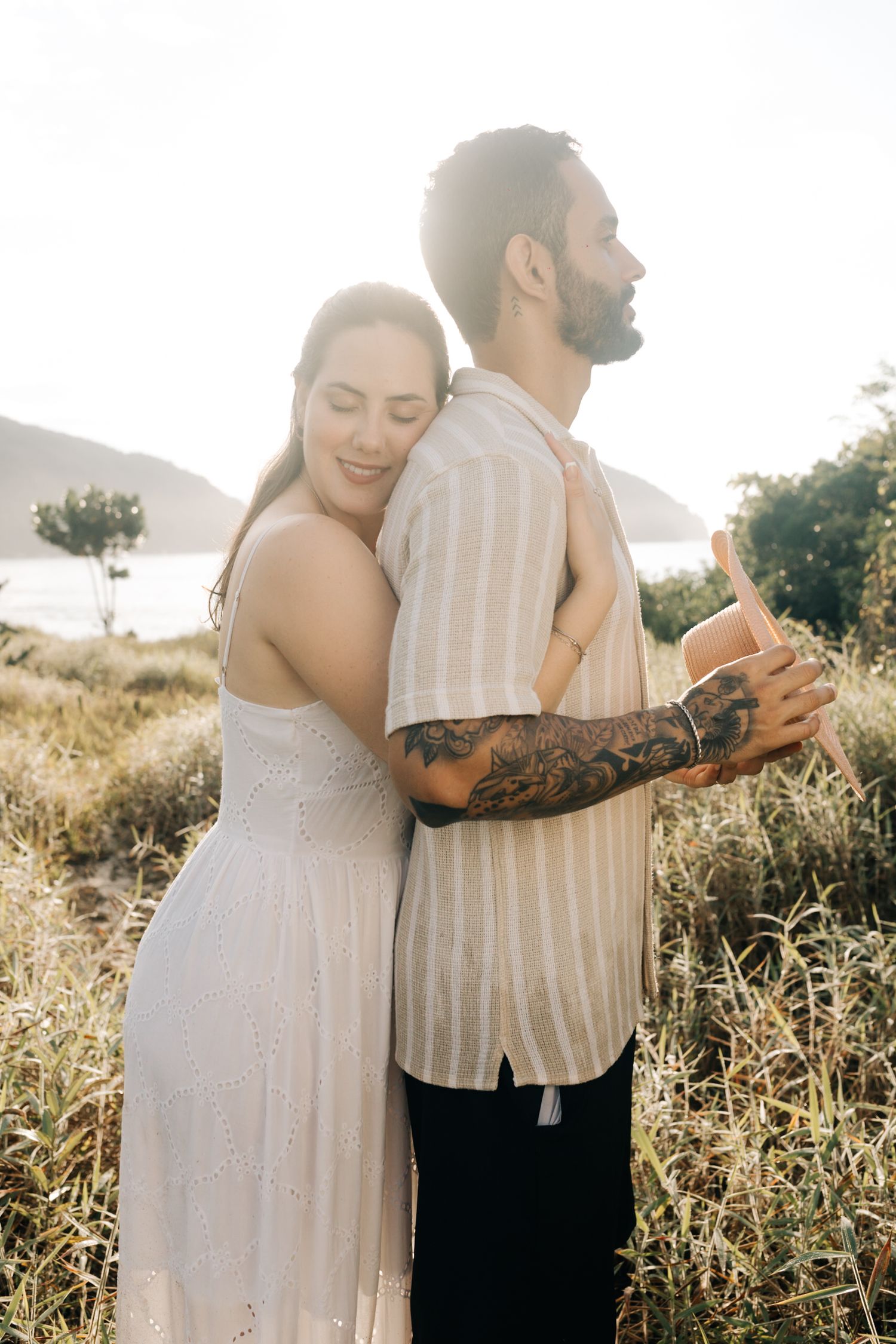 Candid moments of couple dancing and embracing in golden afternoon light.
