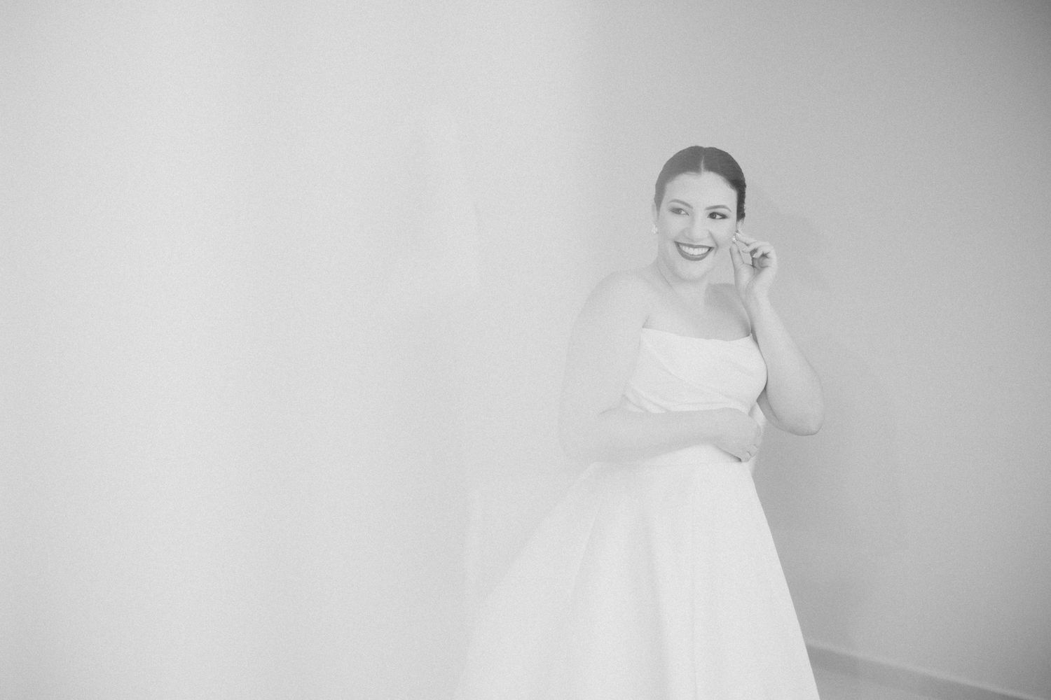 Light and airy portrait session in minimalist white setting.