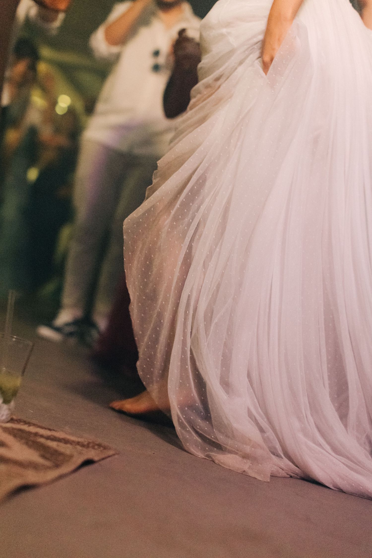 The flowing white wedding dress swirls gracefully during a dance at the reception.