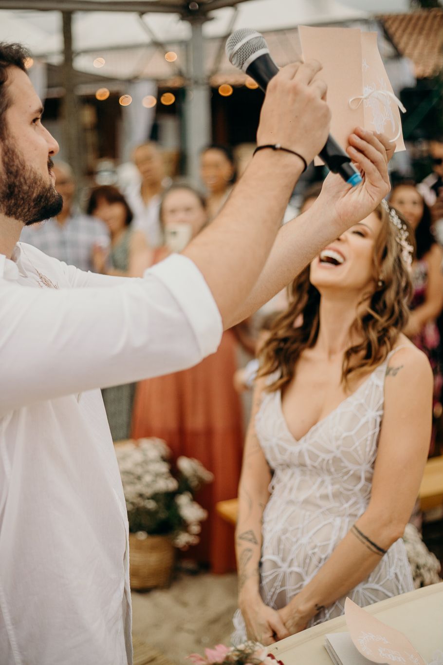 Candid moments of celebration with joyful laughter at an outdoor wedding reception.
